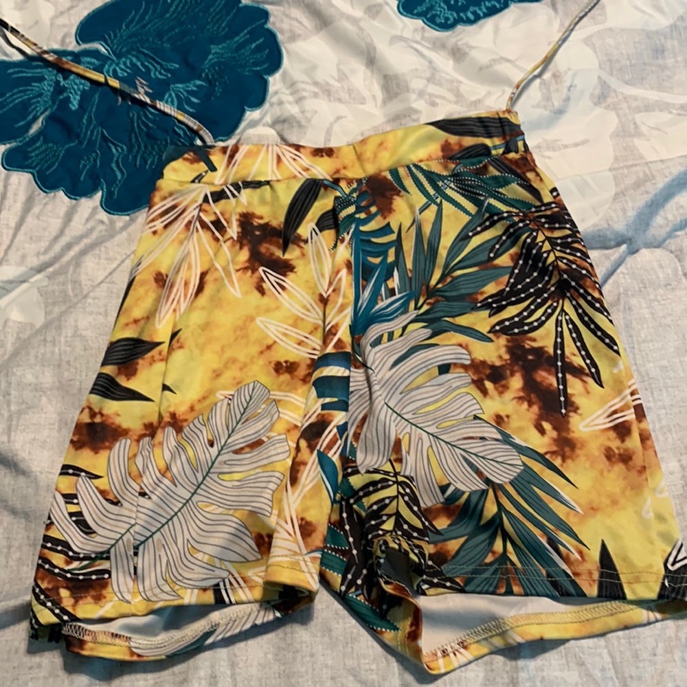 A pair of cute shorts they yellow n other colors like summer wear
